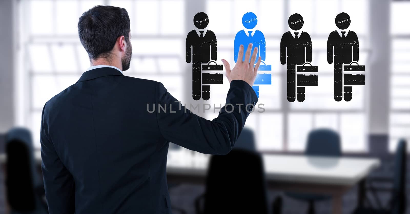 Digital composite of Businessman interacting and choosing a person from group of people icons