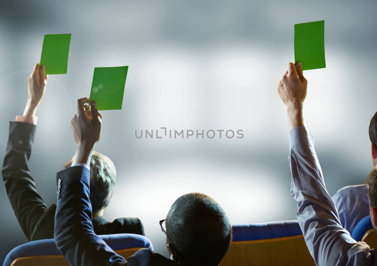 Business conference people holding green cards by Wavebreakmedia