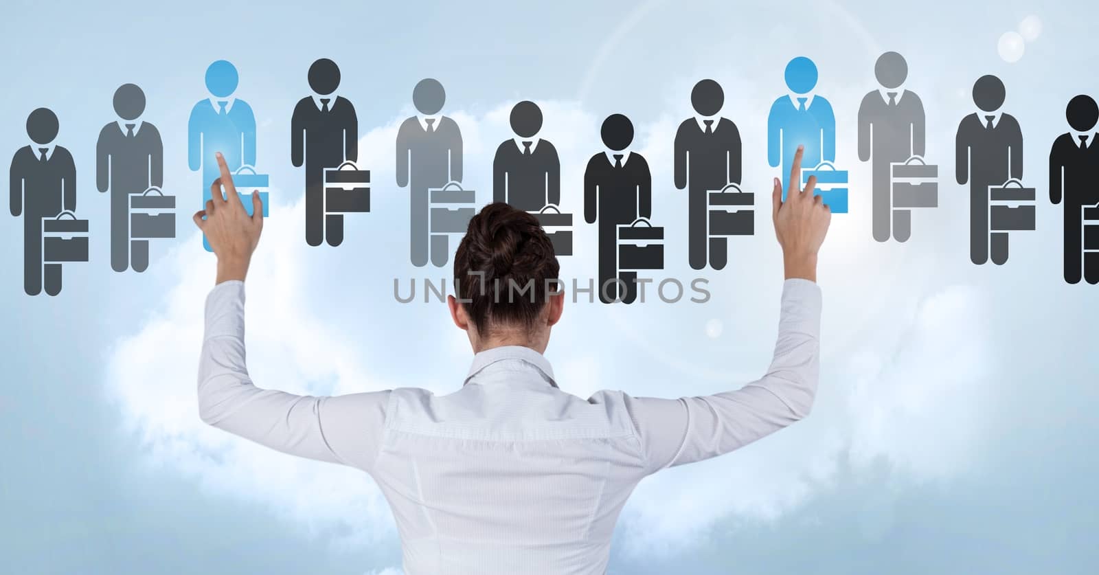 Businesswoman interacting and choosing a person from group of people icons by Wavebreakmedia