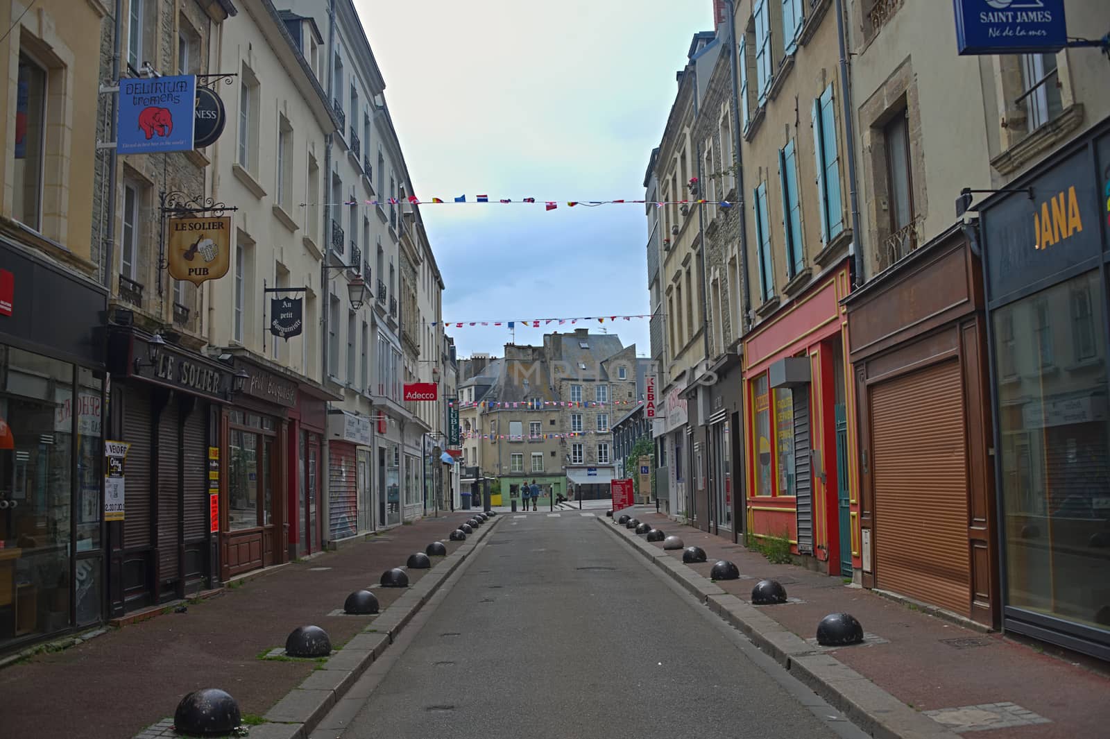 CHERBOURG, FRANCE - June 6th 2019 - Empty street with stone building in traditional town by sheriffkule