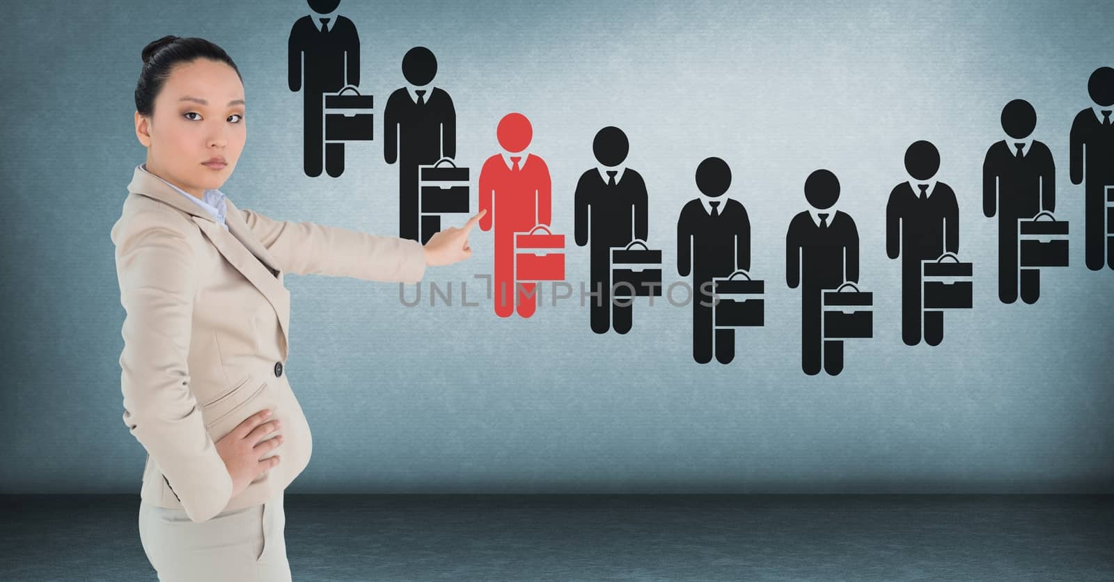 Businesswoman interacting and choosing a person from group of people icons by Wavebreakmedia