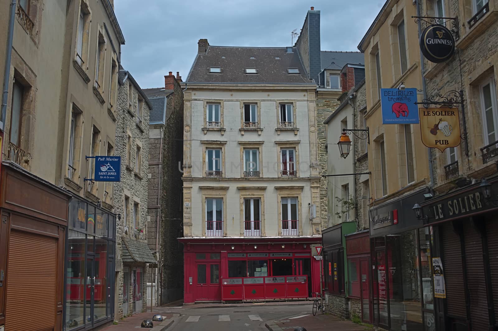 CHERBOURG, FRANCE - June 6th 2019 - Empty street with stone building in traditional town
