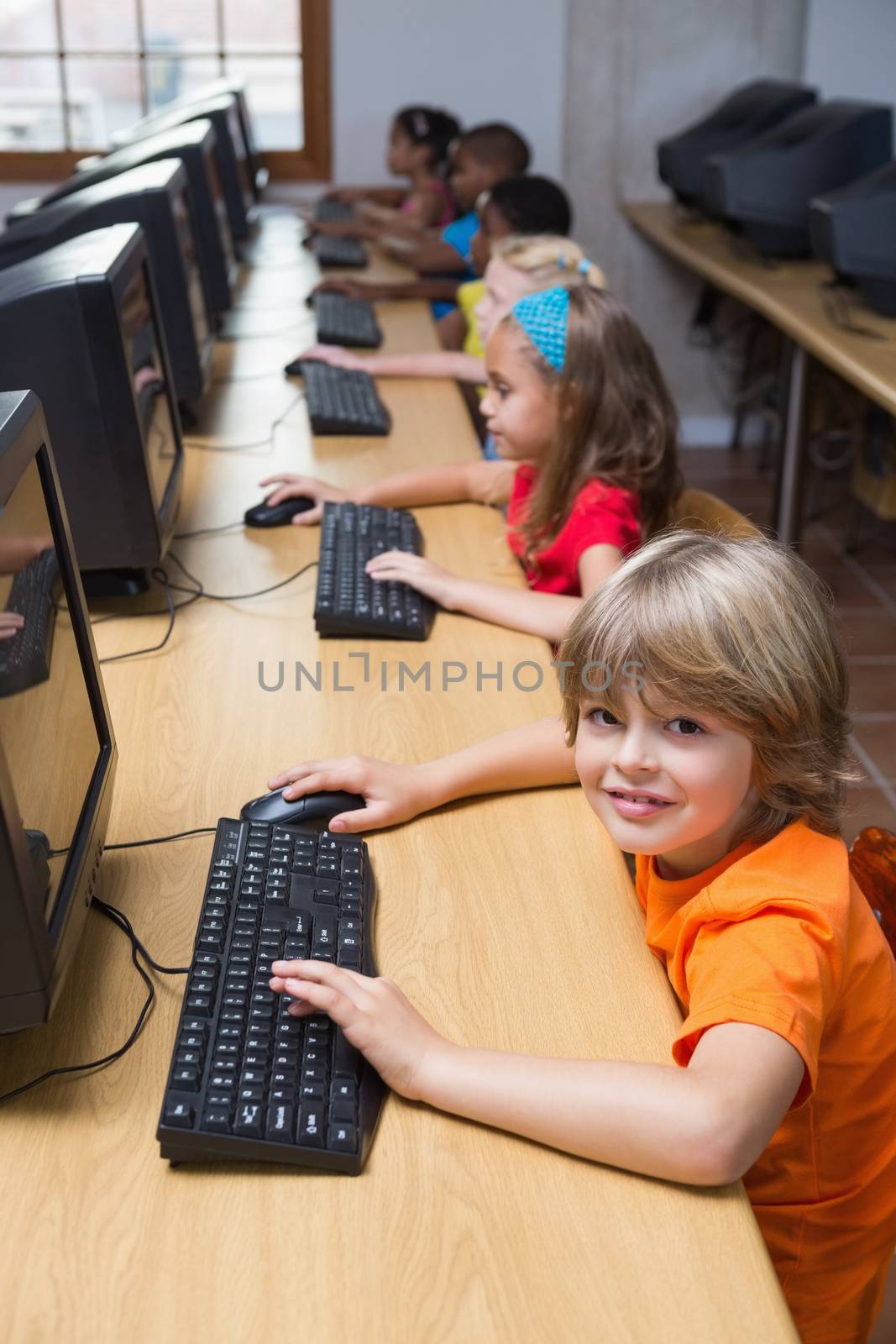 Cute pupils in computer class by Wavebreakmedia