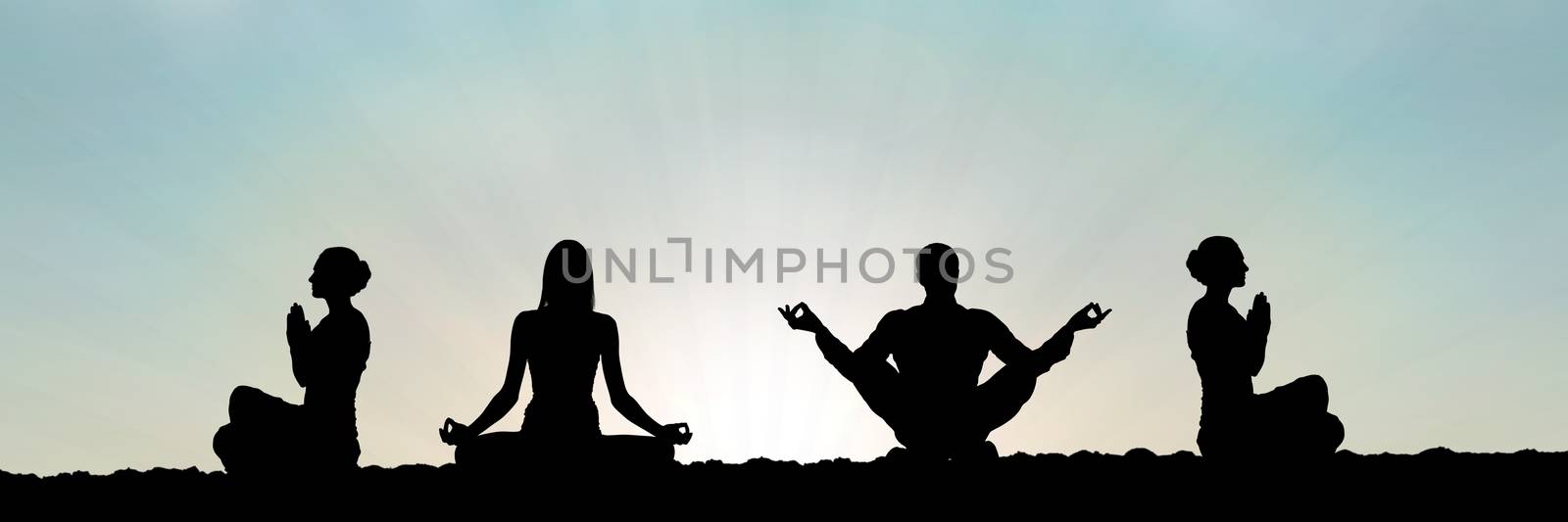 yoga group silhouette at sunset praying by Wavebreakmedia