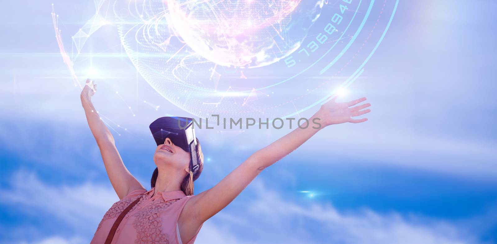 Woman with arms raised looking through virtual reality simulator against white background against global technology background in blue