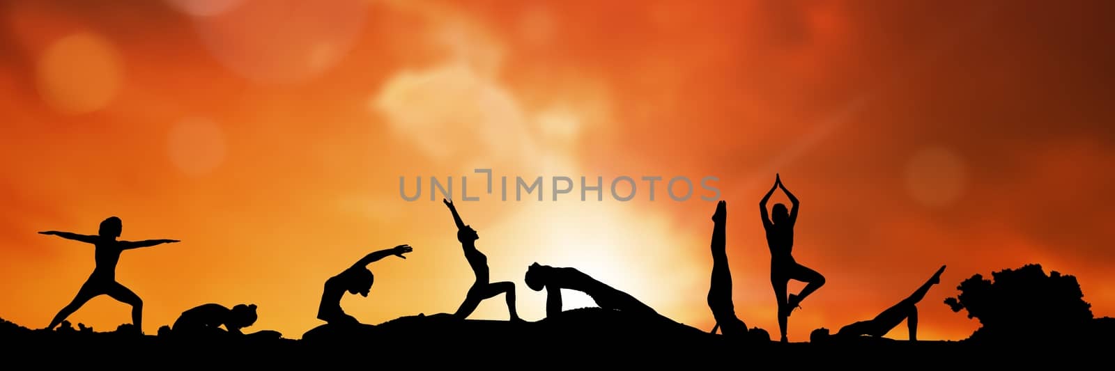 yoga group silhouette at sunset by Wavebreakmedia