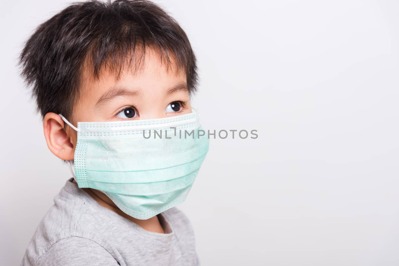 Closeup Asian face, Little children boy sick he using medicine healthcare mask on white background with copy space, health medical care