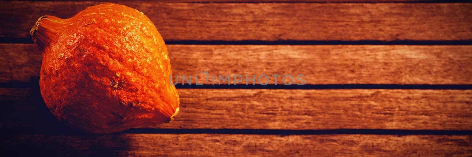 Squash on wooden table during Halloween by Wavebreakmedia
