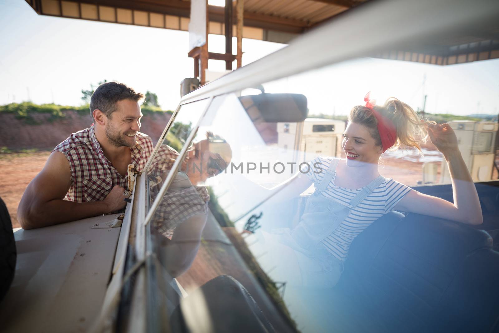 Romantic couple with a car in petrol pump