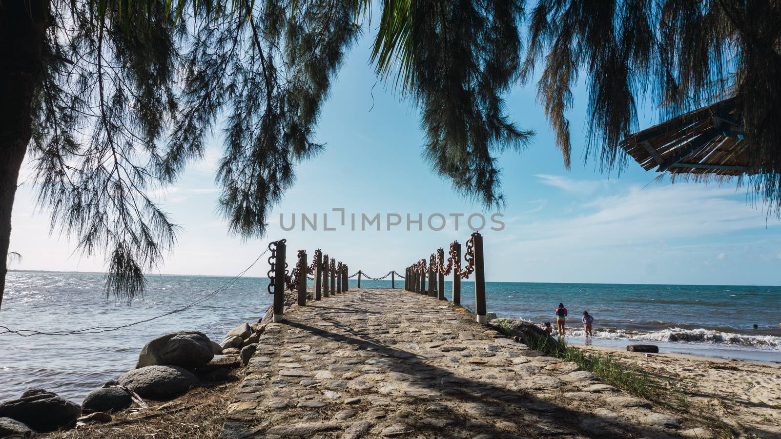 Beautiful view on the pier with a blue sky and ocean