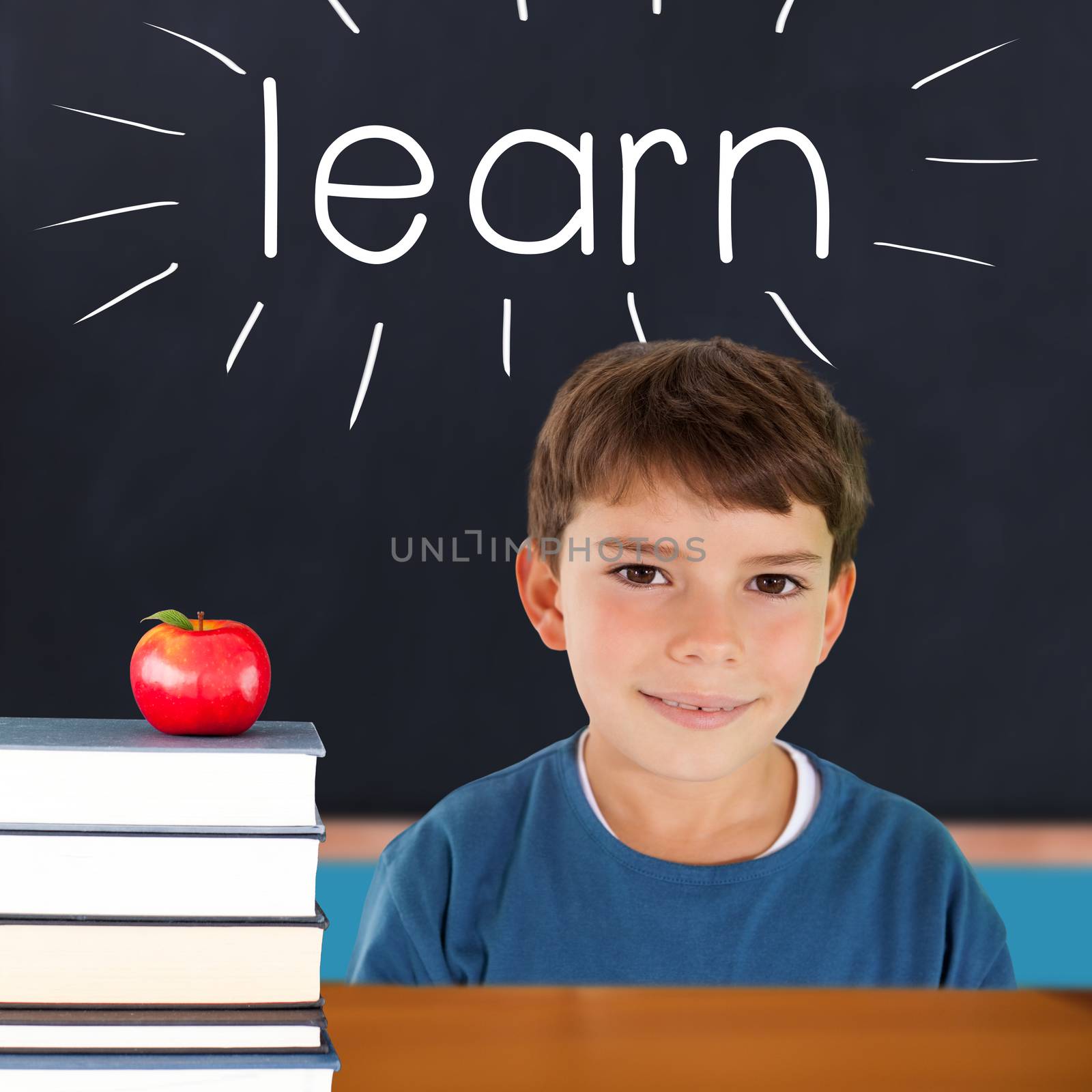 The word learn and cute boy smiling against red apple on pile of books in classroom