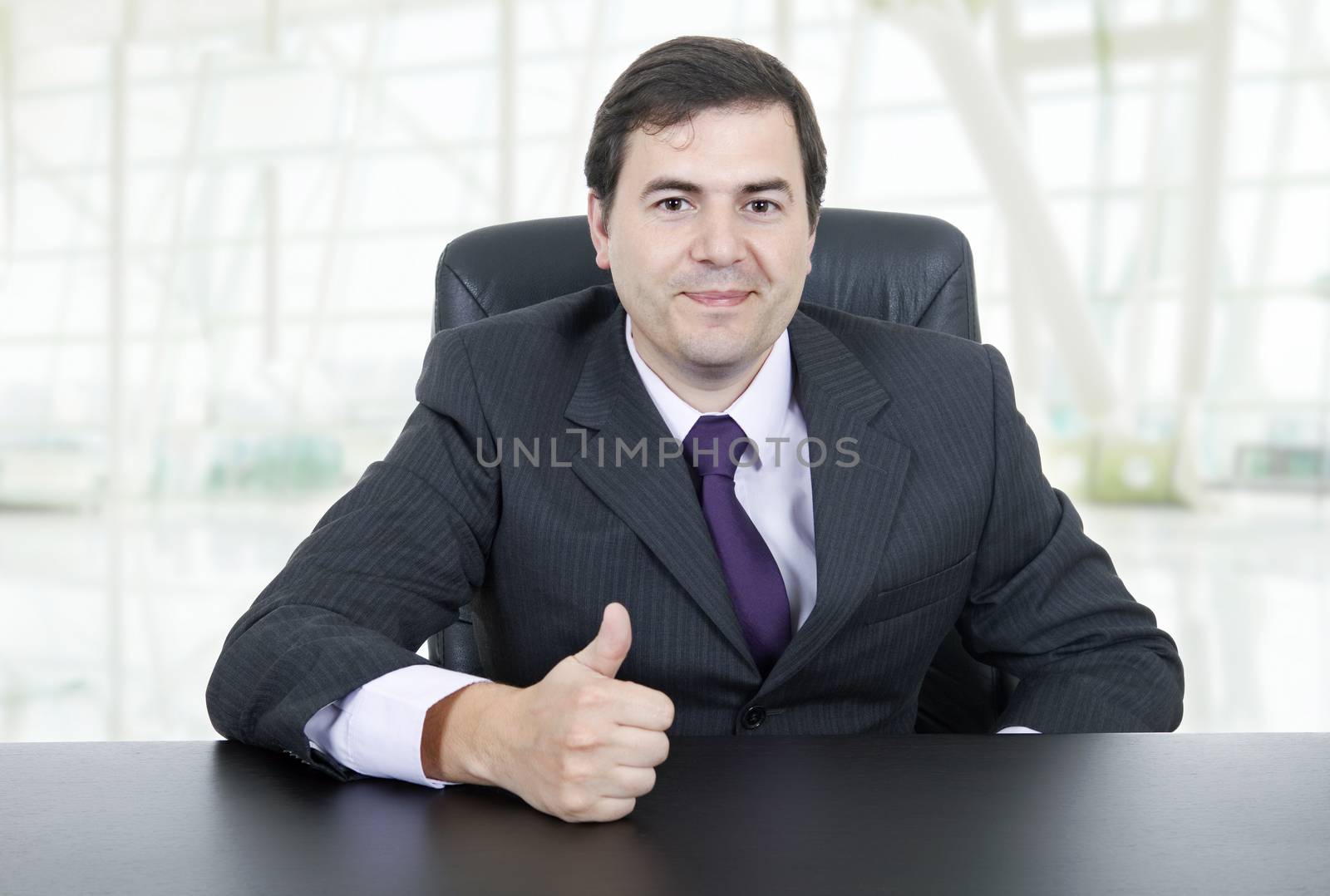 young business man on a desk, at the office