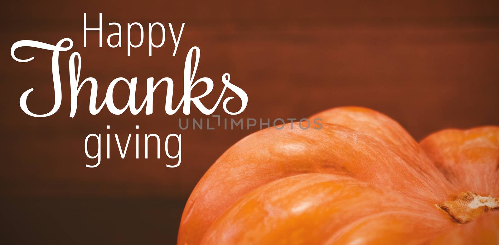 Thanksgiving greeting text against cropped image of pumpkin during halloween