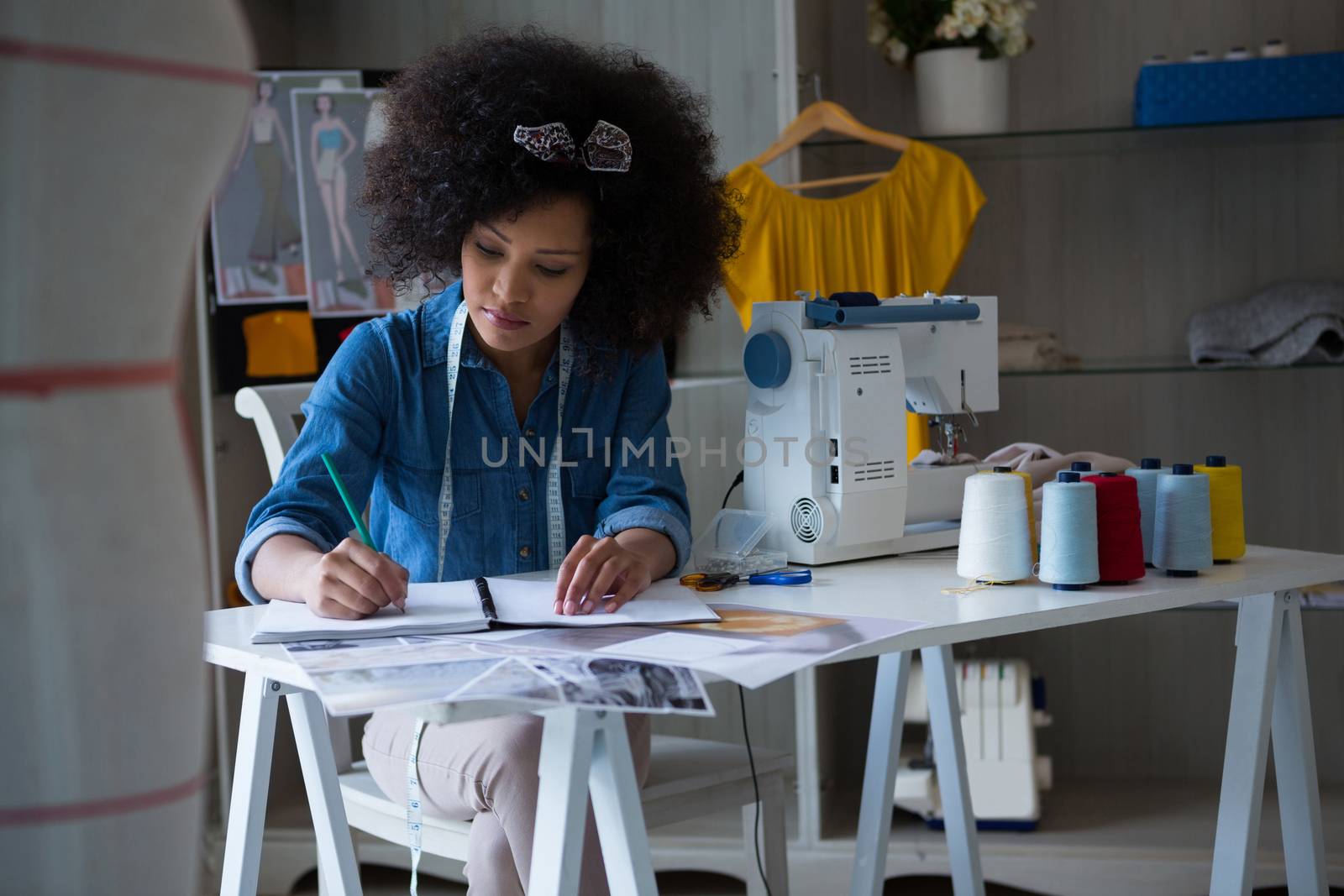 Female fashion designer working at desk by Wavebreakmedia