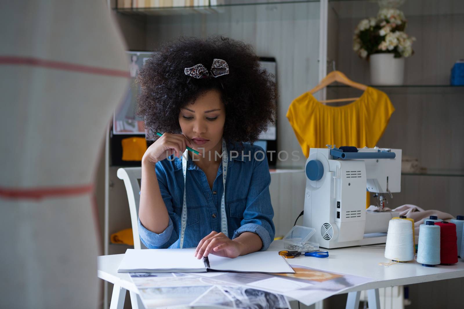 Female fashion designer working at desk by Wavebreakmedia