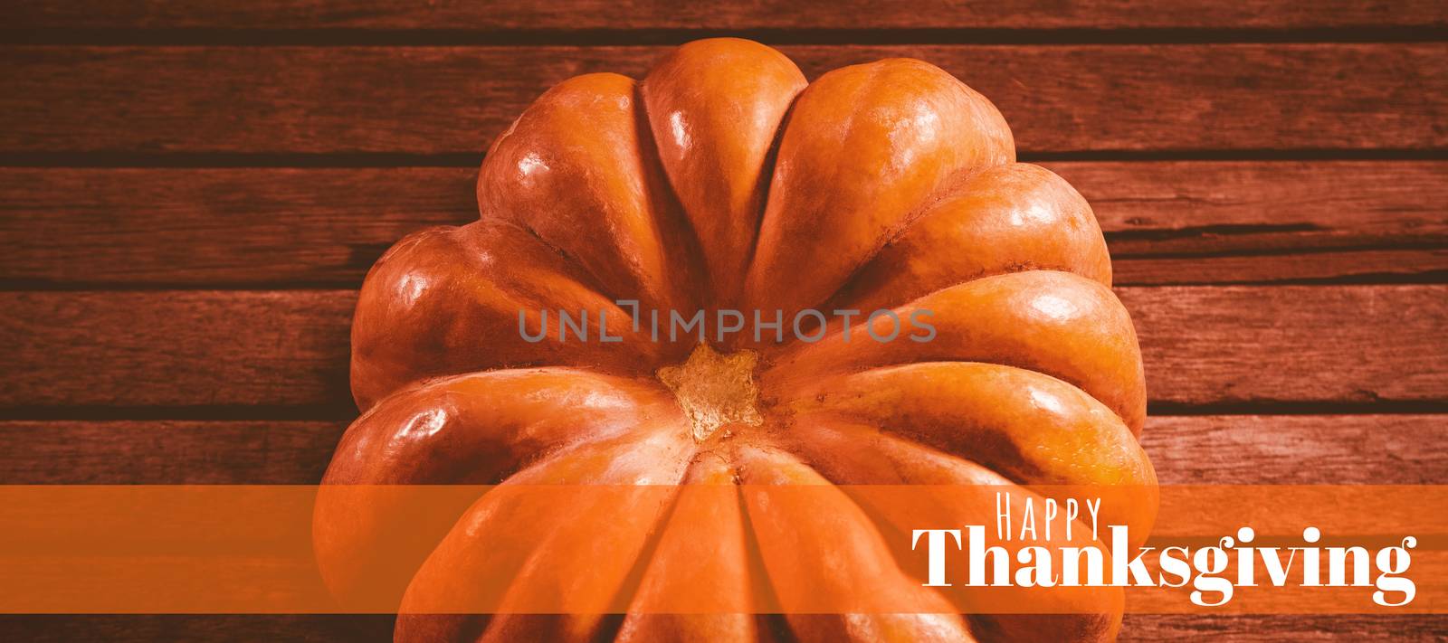 Digitally generated image of happy thanksgiving text against view of pumpkin on wooden table during halloween