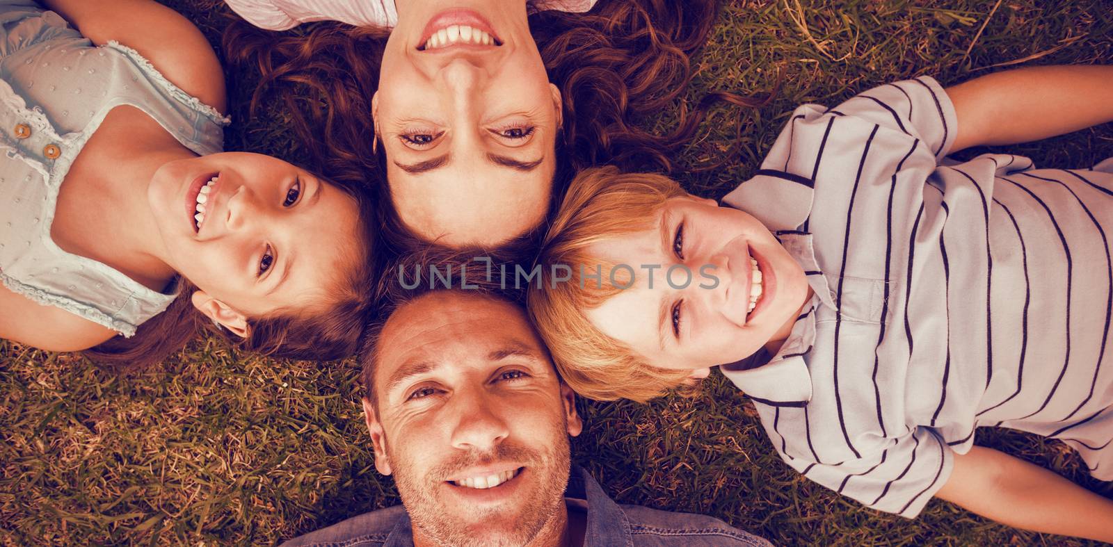 Happy family in park together by Wavebreakmedia