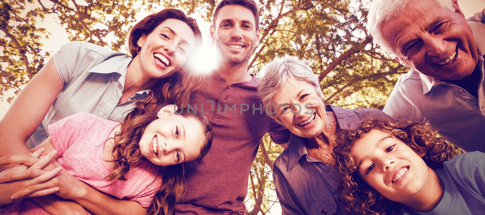 Happy family smiling at park by Wavebreakmedia