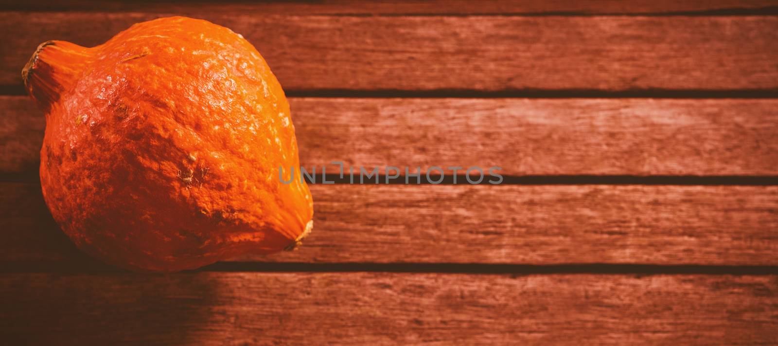 Squash on wooden table during Halloween by Wavebreakmedia
