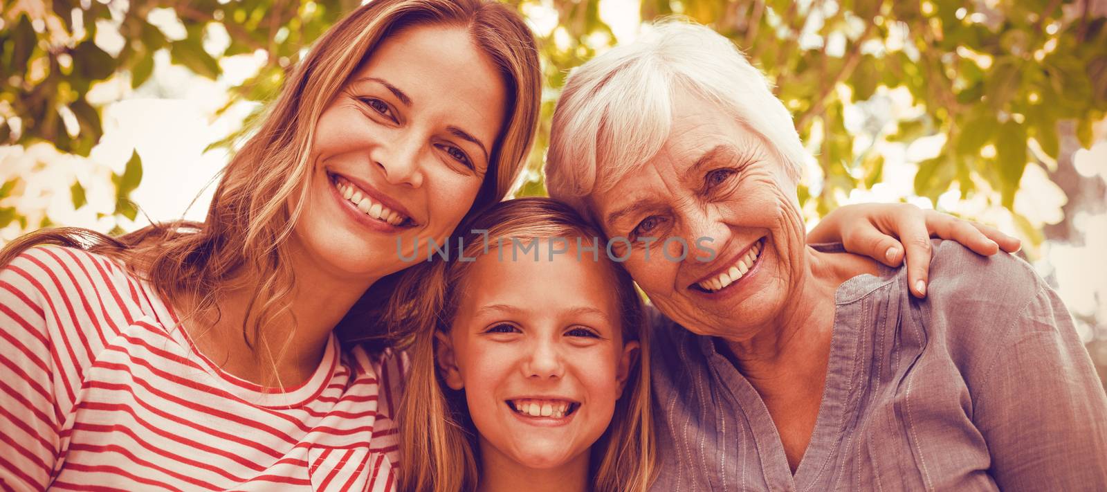 Portrait of happy family with granny standing outdoors