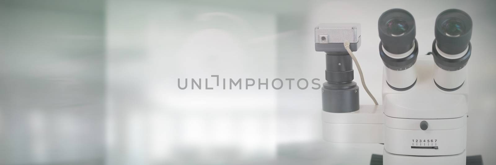 Composite image of microscope in laboratory  by Wavebreakmedia