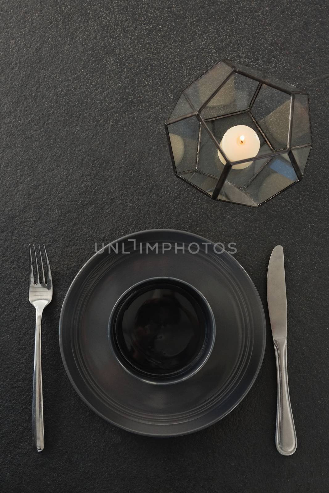 Close-up of black theme table setting