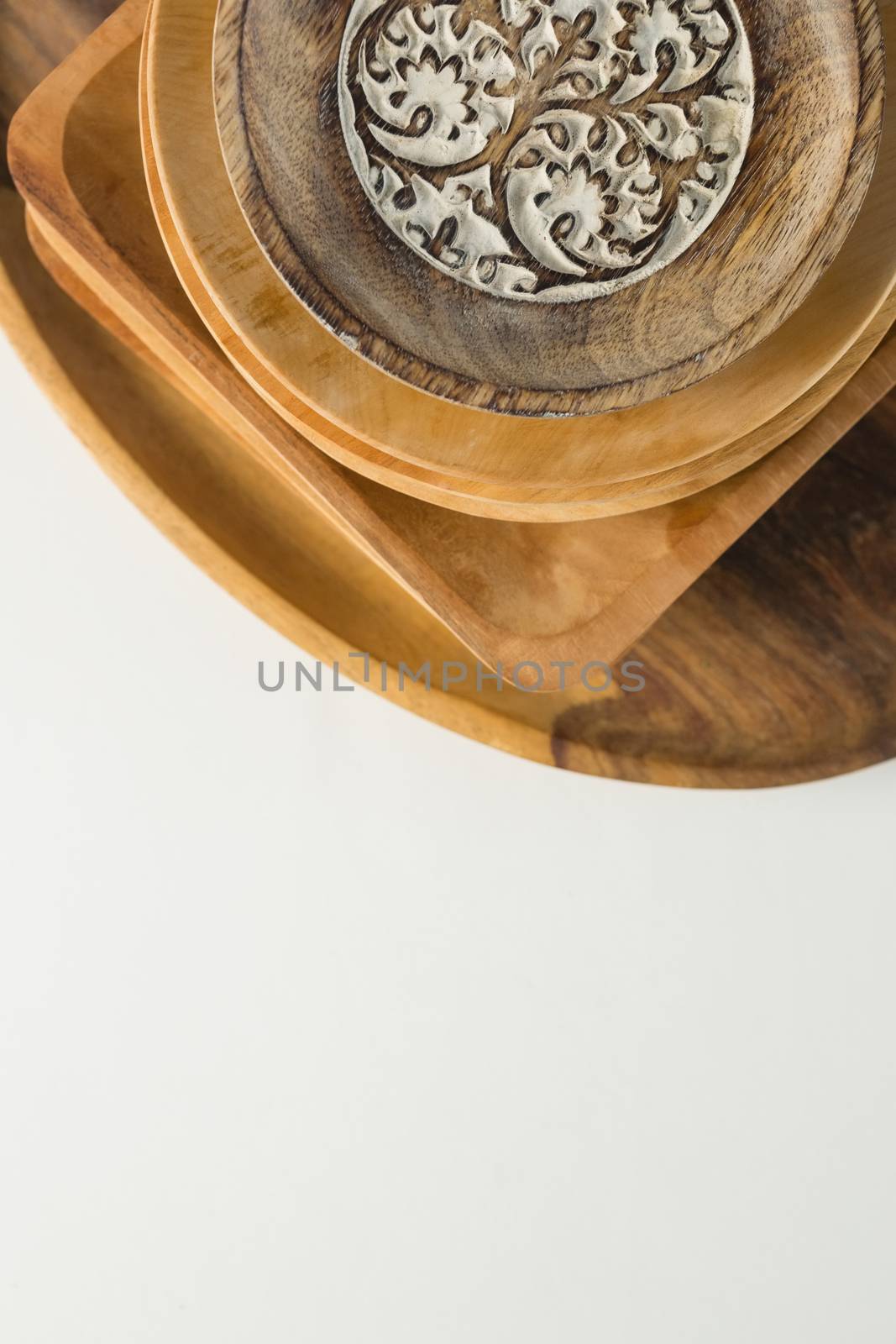 Close-up of wooden plates set on dinning table