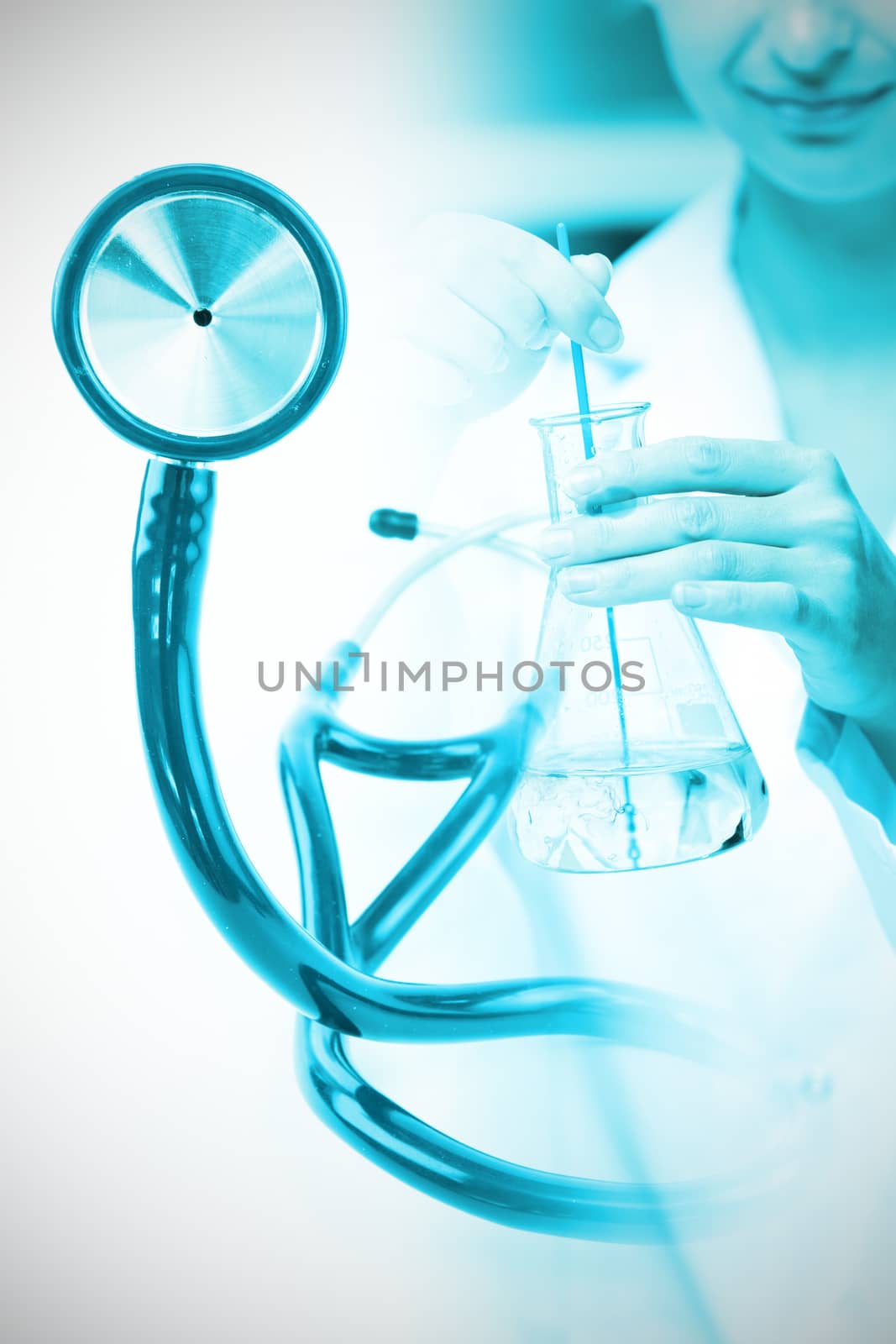 Blue stethoscope  against portrait of a female scientist shaking liquid in an erlenmeyer
