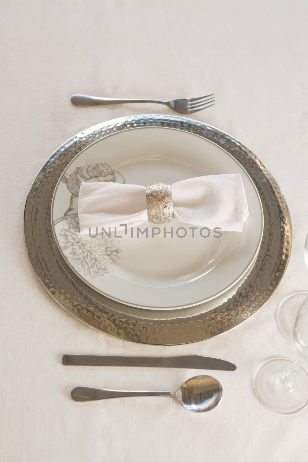 Close-up of plate and cutlery set elegantly on a table