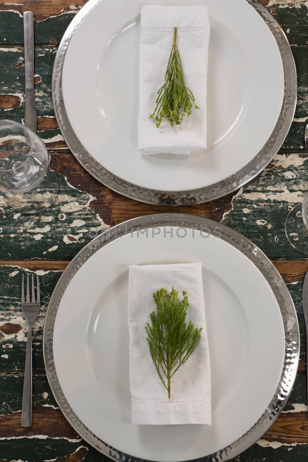 Overhead of table setting on weathered wooden plank