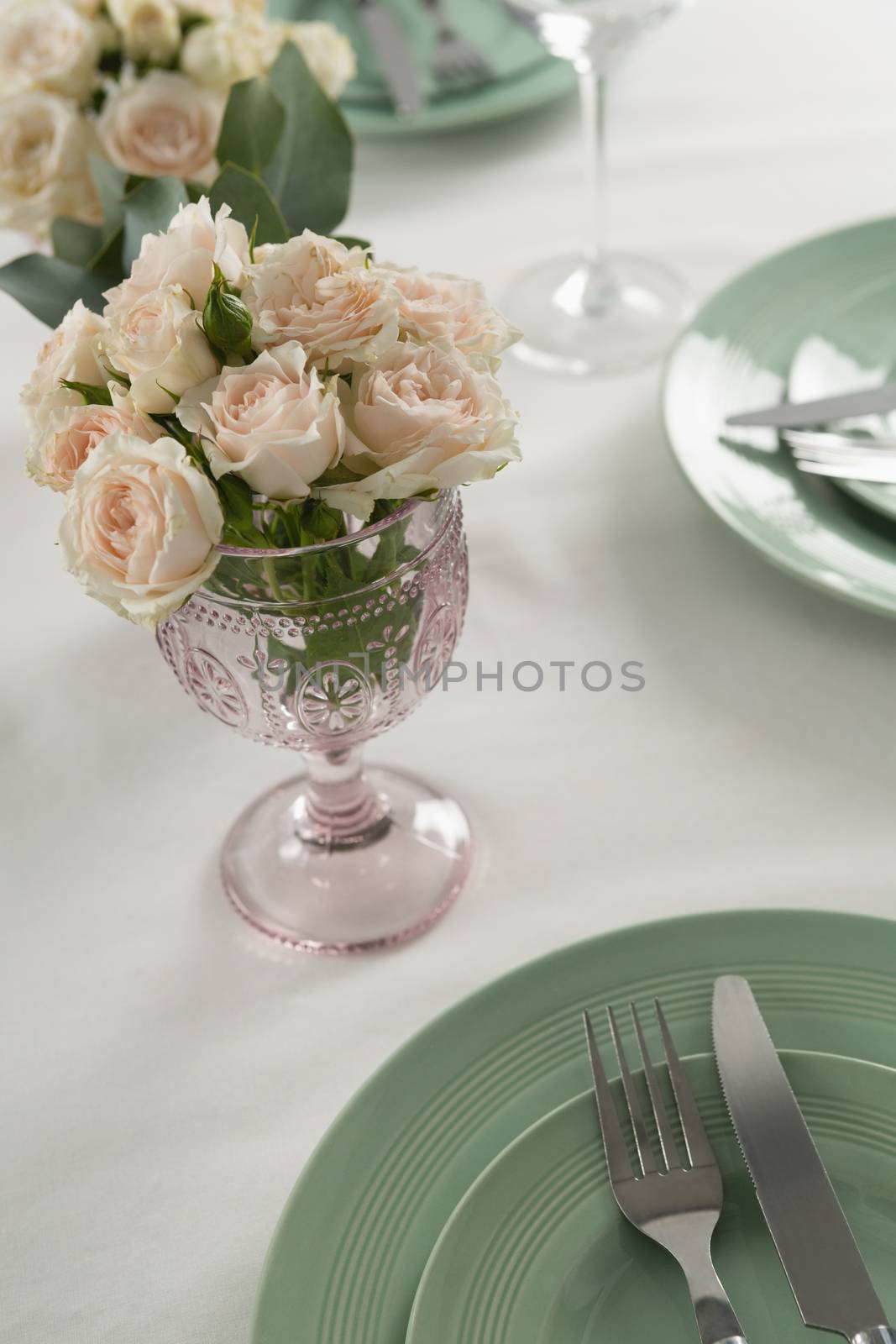 Close-up of plate and cutlery set elegantly on a table
