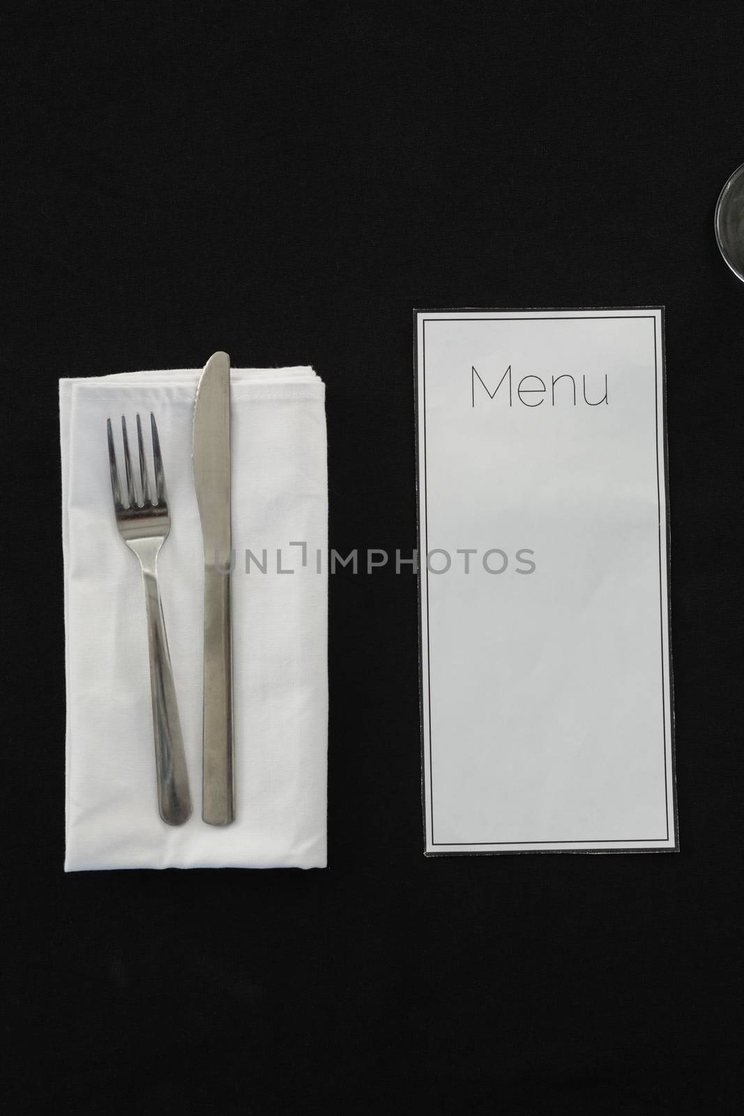 Black theme table setting with menu card