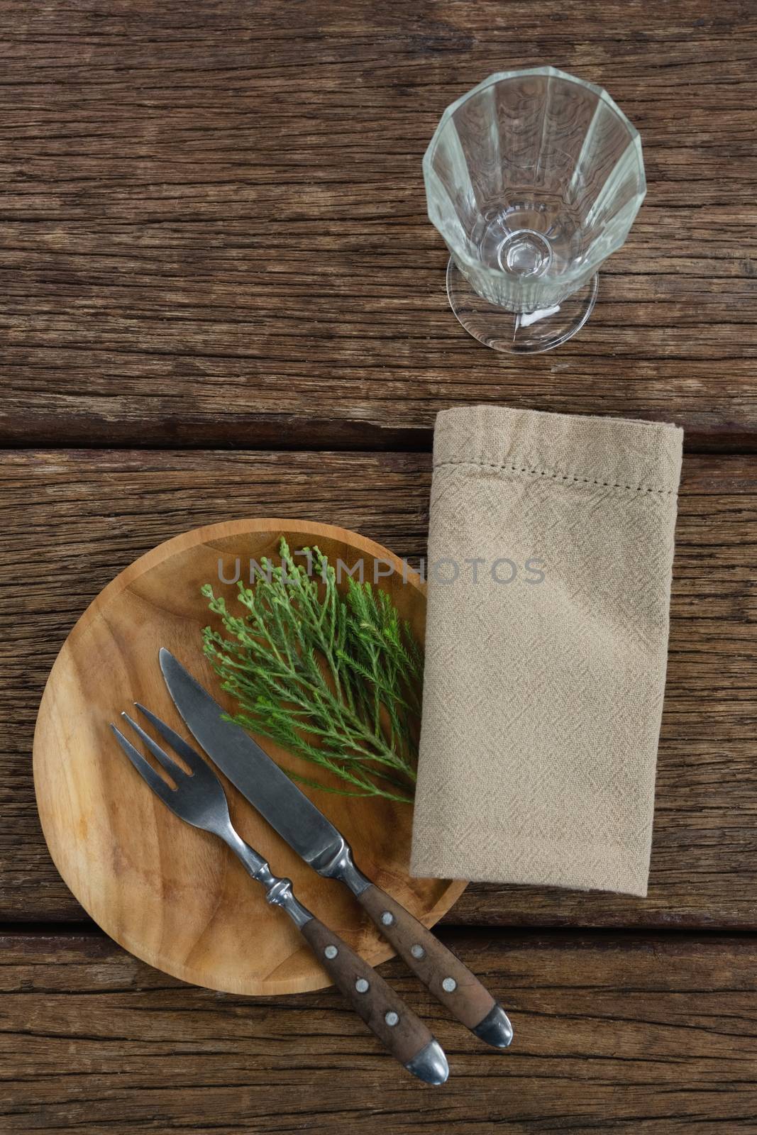 Overhead of flora and cutlery arranged on plate 