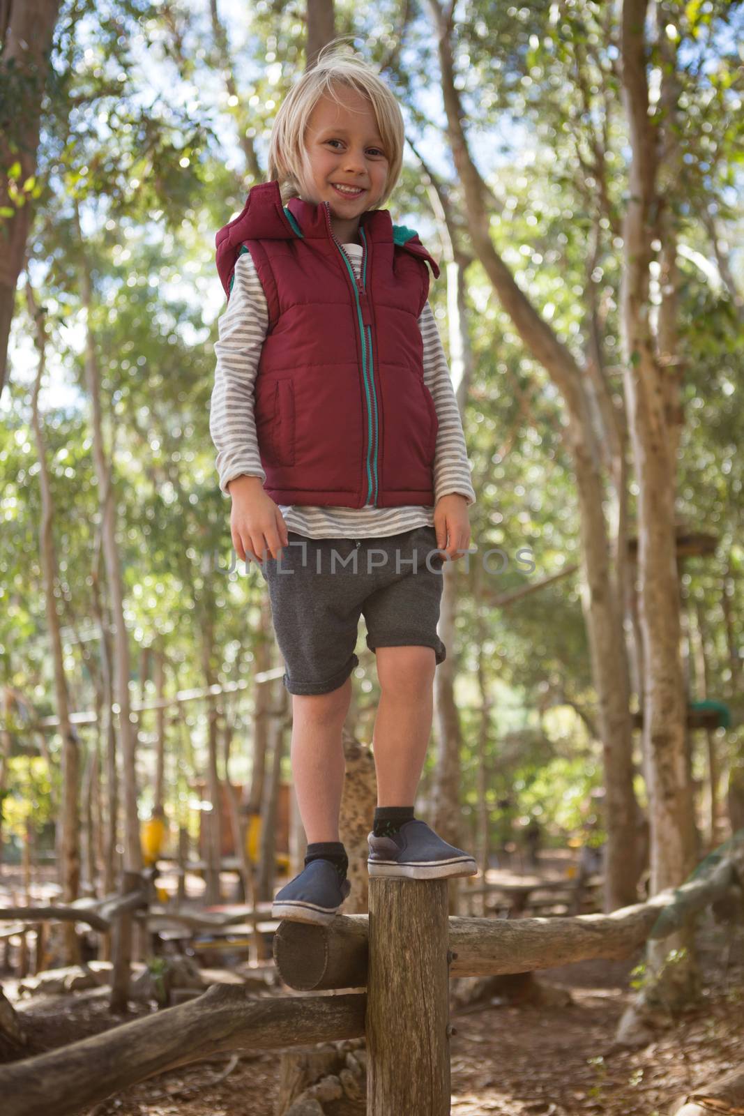 Portrait of little girl walking on woods in the forest