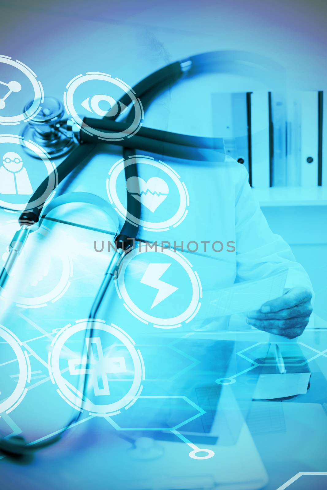 Medical icons set against stethoscope on desk