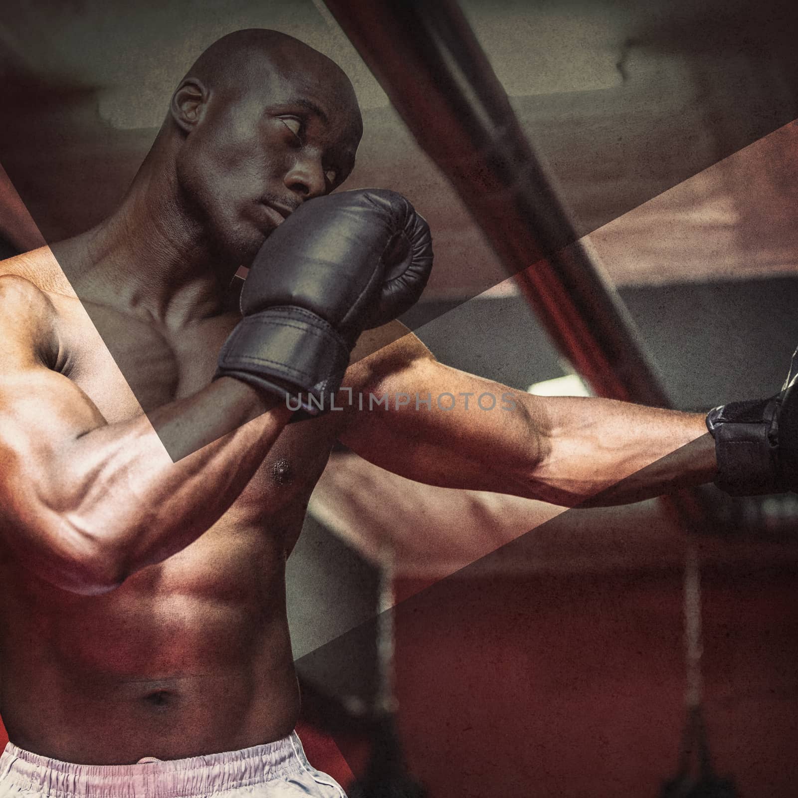 Young Bodybuilder boxing a bag in the crossfit gym