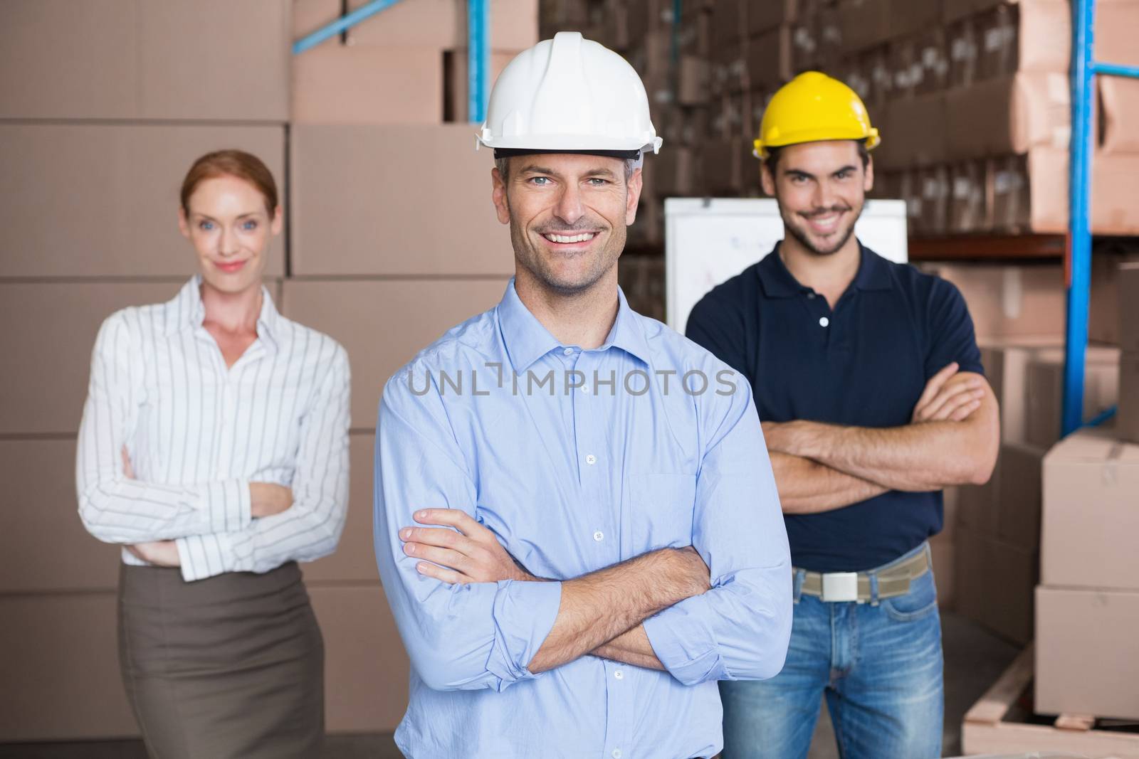 Warehouse team smiling at camera by Wavebreakmedia