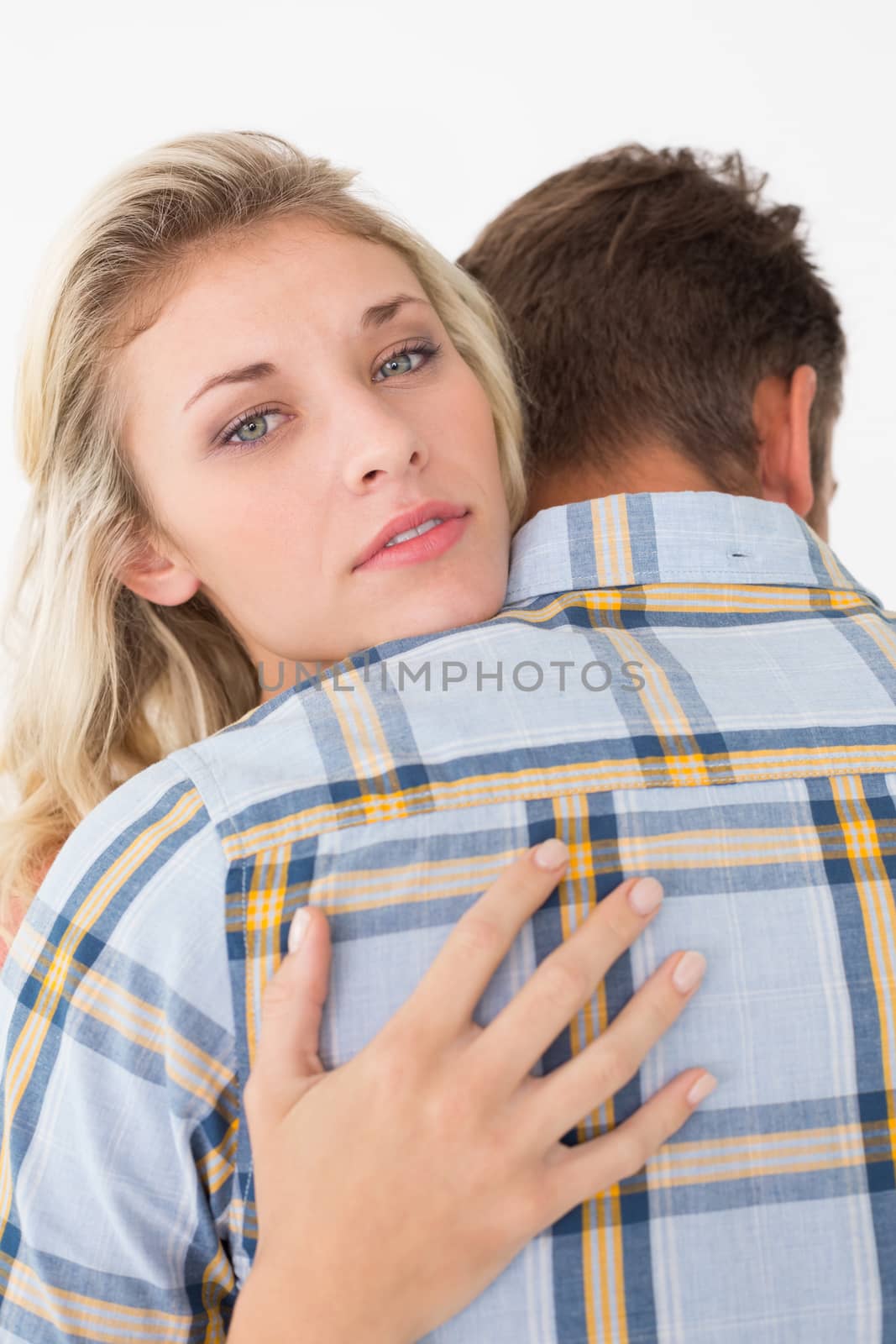 Close up of young couple embracing by Wavebreakmedia
