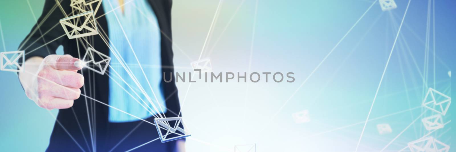 Mid section of businesswoman touching imaginary interface against abstract grey background