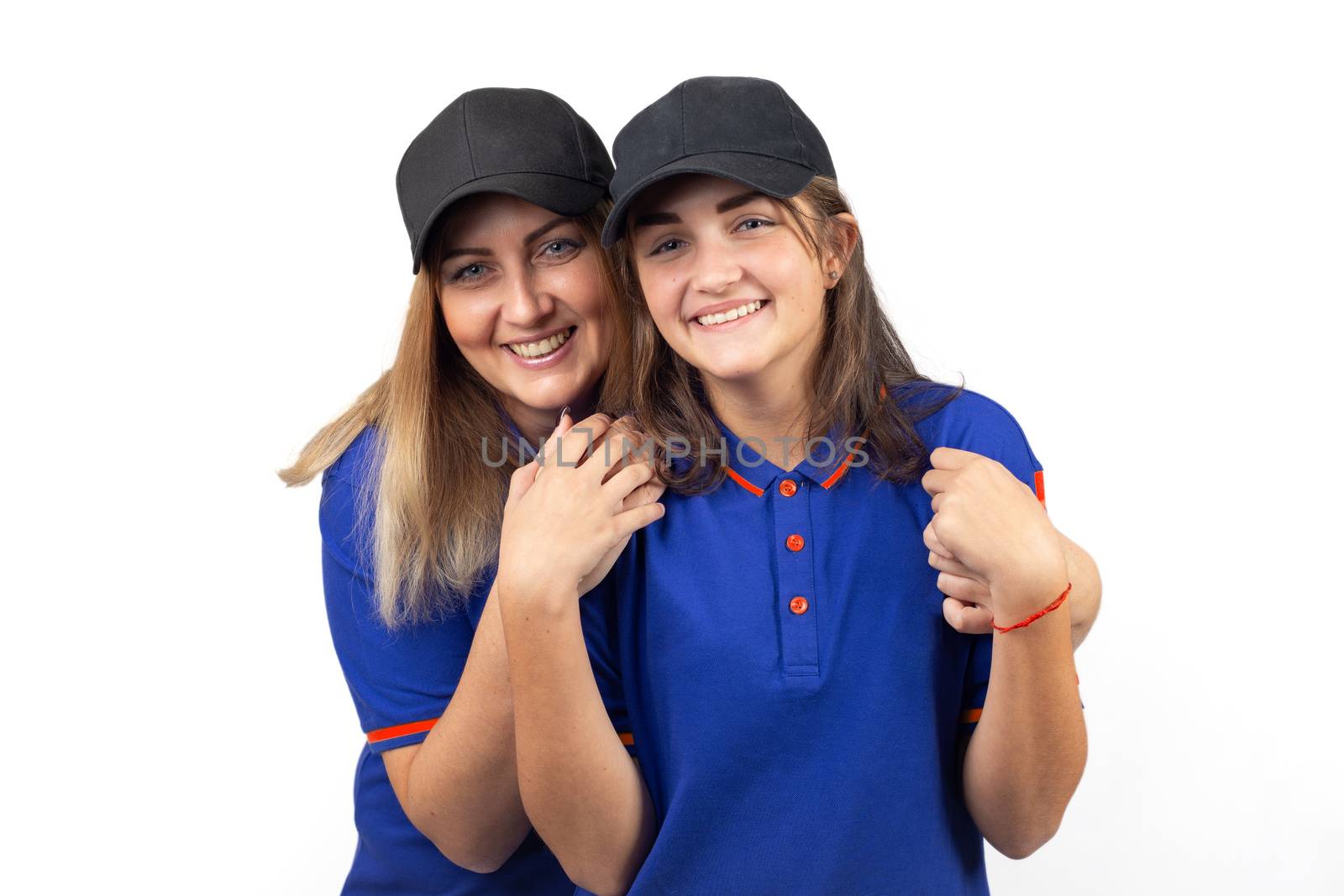 Portrait of two happy women, mother and daughter in blue T-shirts by Madhourse