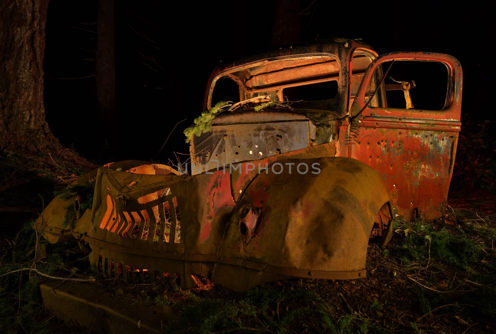 Abandoned Antique Rusting in the Forest at Night by backyard_photography