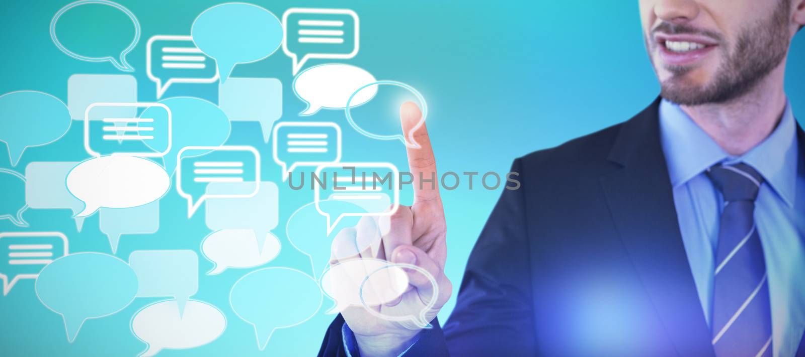 Mid section of smiling businessman touching invisible screen against abstract blue background