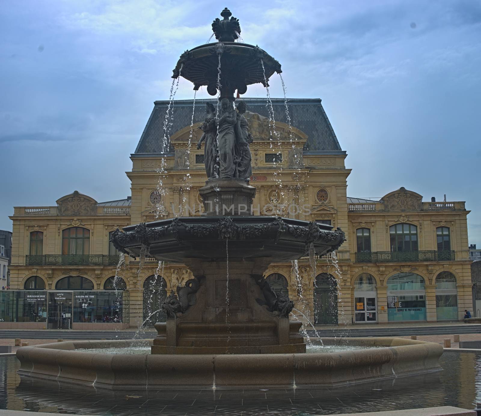 CHERBOURG, FRANCE - June 6th 2019 - impressive fountain with theater building behind it by sheriffkule