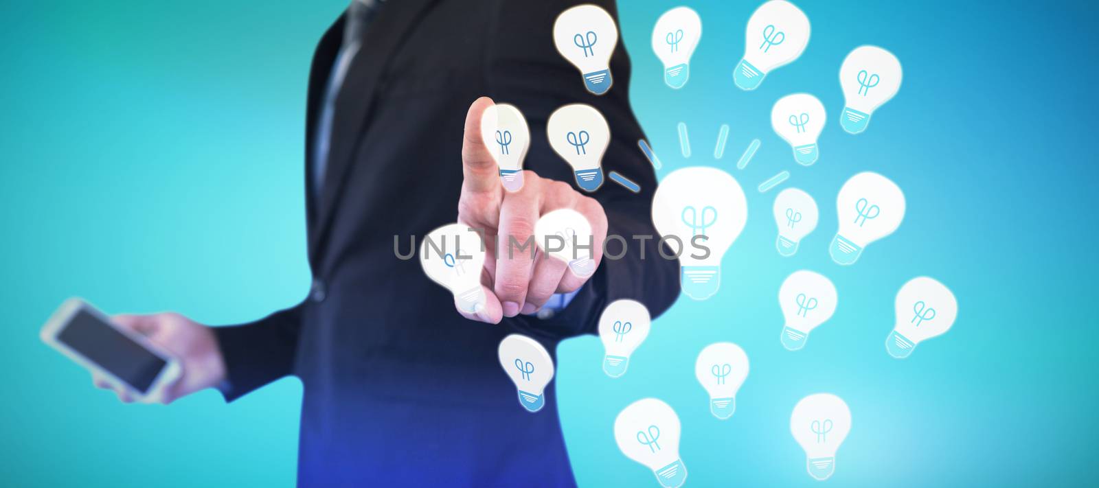 Mid section of businessman holding smartphone while using invisible interface against abstract blue background