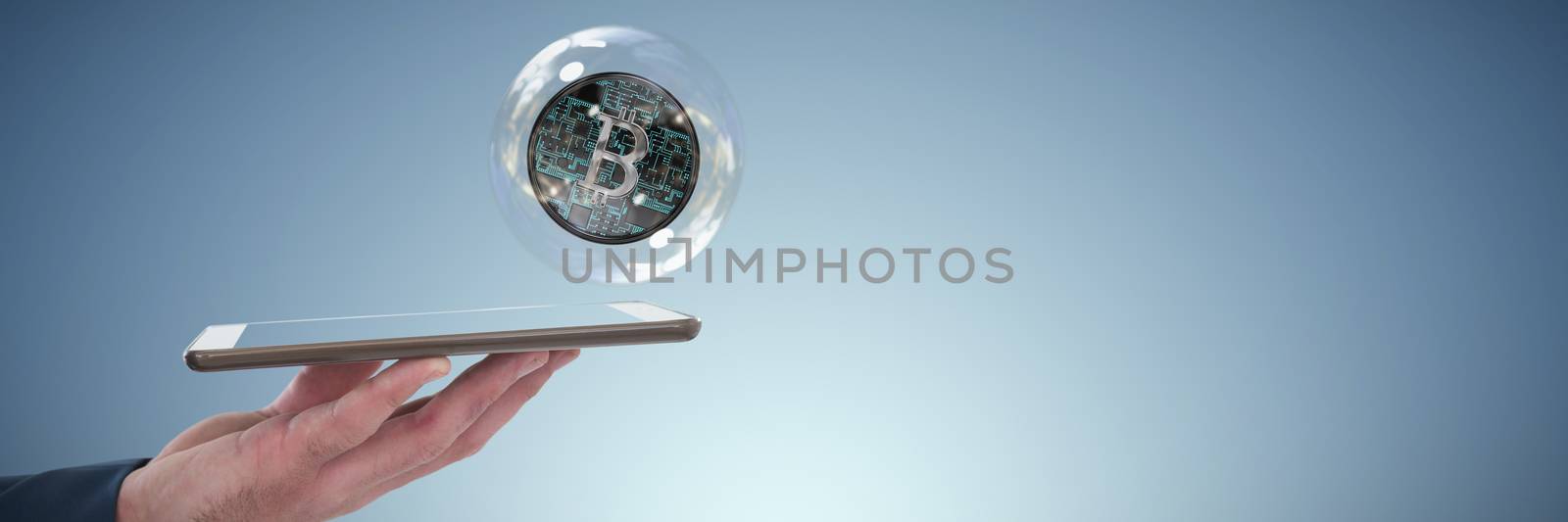 Cropped hand of businessman holding tablet computer against abstract blue background