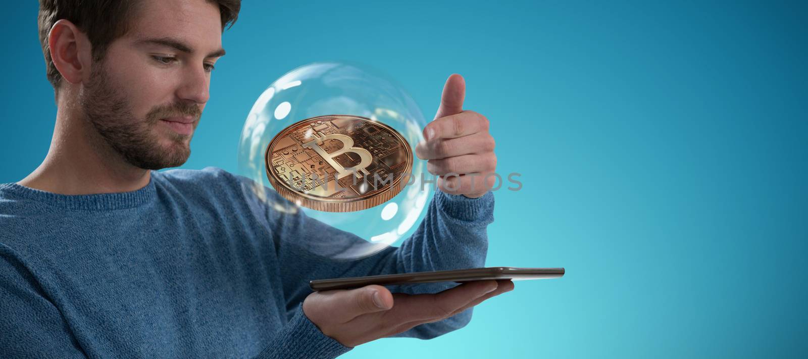 Man holding digital tablet against abstract blue background