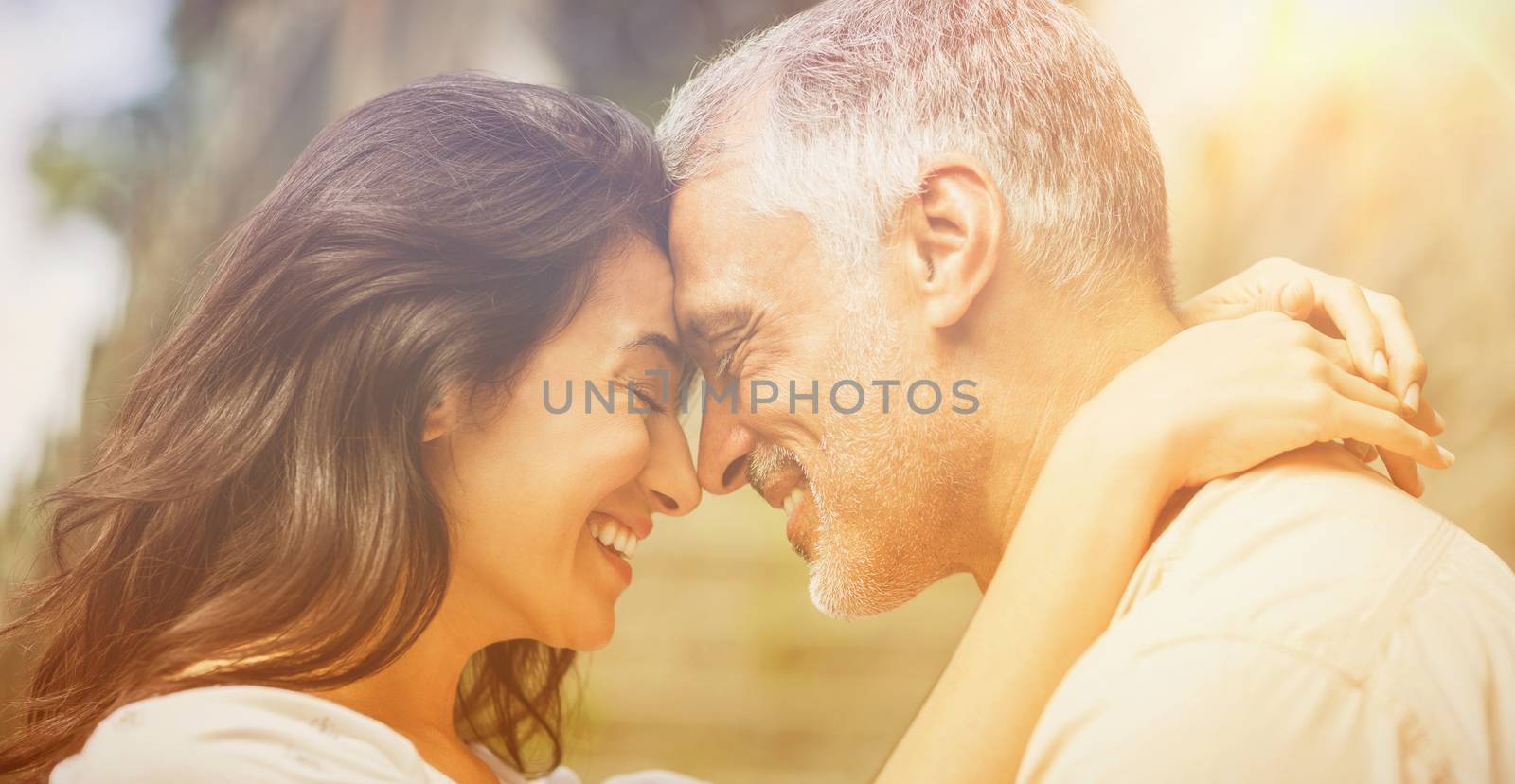 Close-up of happy couple embracing by Wavebreakmedia