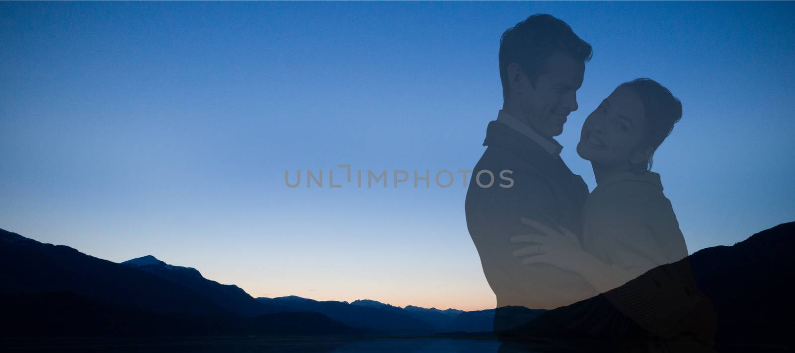 Composite image of full length of romantic couple hugging by Wavebreakmedia