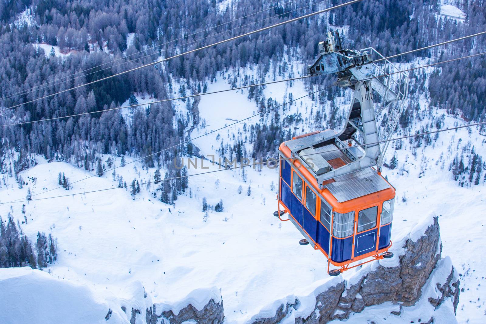 Gondola lift cable car on ski resort Cortina d'Ampezzo winter city view from Faloria ski area