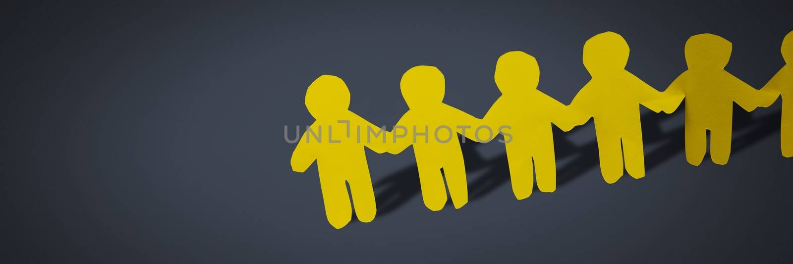 Paper cut out people holding hands together in line by Wavebreakmedia